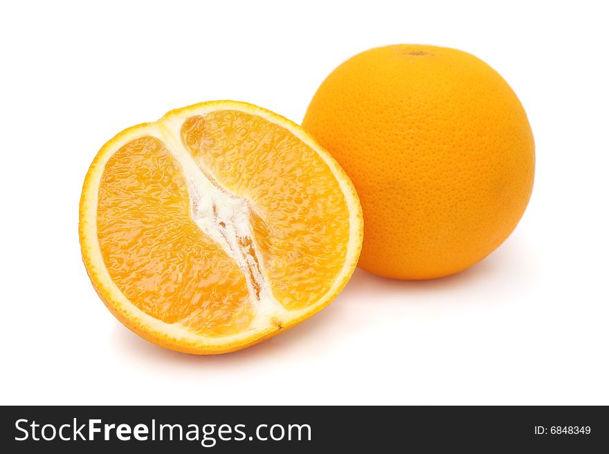 One and half oranges isolated on white background.