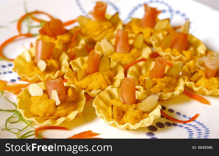 Appetizers with smoked salmon and almond in little baskets. Appetizers with smoked salmon and almond in little baskets