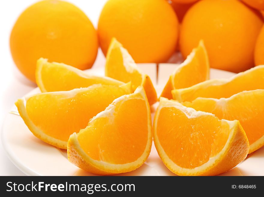 Orange pieces put together with fresh orange. Orange pieces put together with fresh orange.