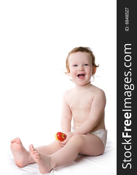 Cute caucasian child sits on a white table. Cute caucasian child sits on a white table