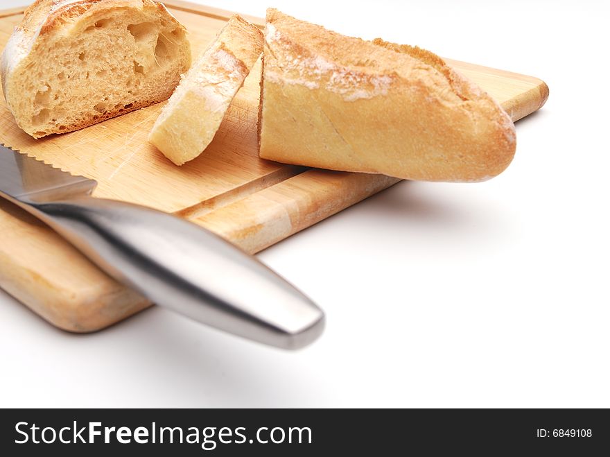 Sliced white bread on a wood cutting board