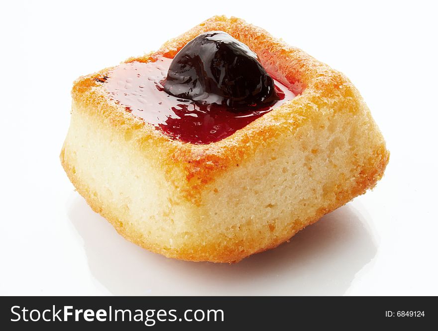 Fruitcake with a stuffing on a white background