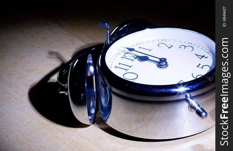 A close up shot of an alarm clock on black background