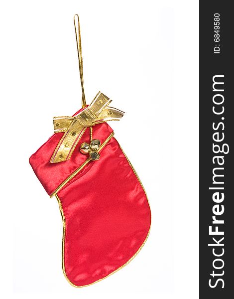 Red satin christmas stocking ornament isolated on white.