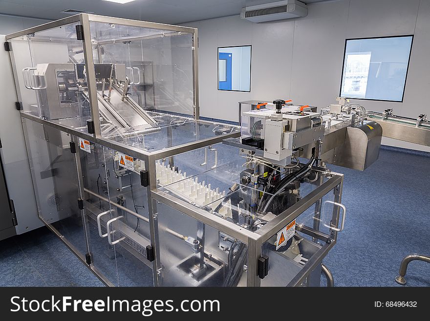 Photos sterile production area with the machine for the production of tablets and sorting