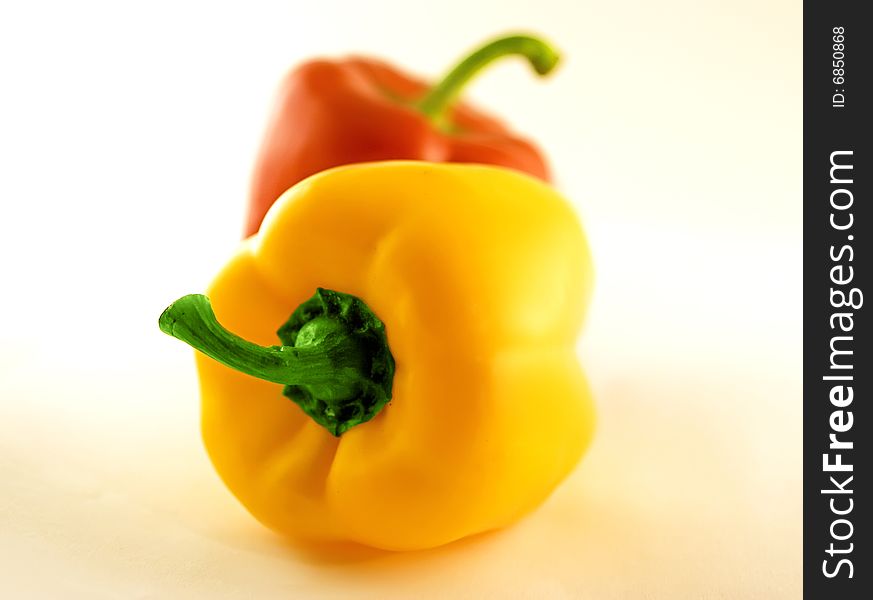 Sweet peppers lying on white background