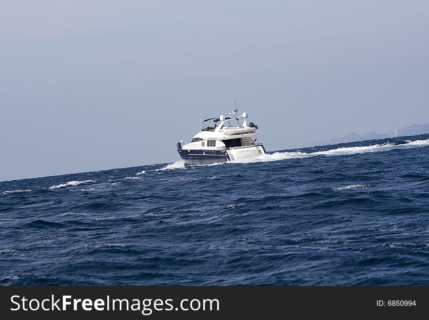 Cabin cruiser at the middle of the sea