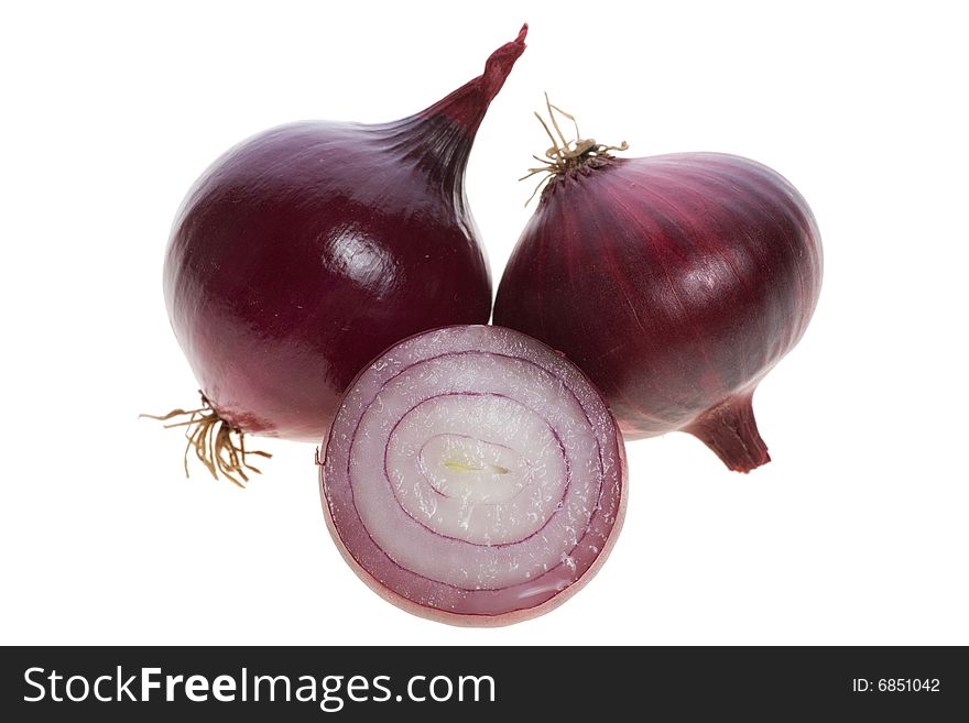 Isolated macro image of fresh red onions.