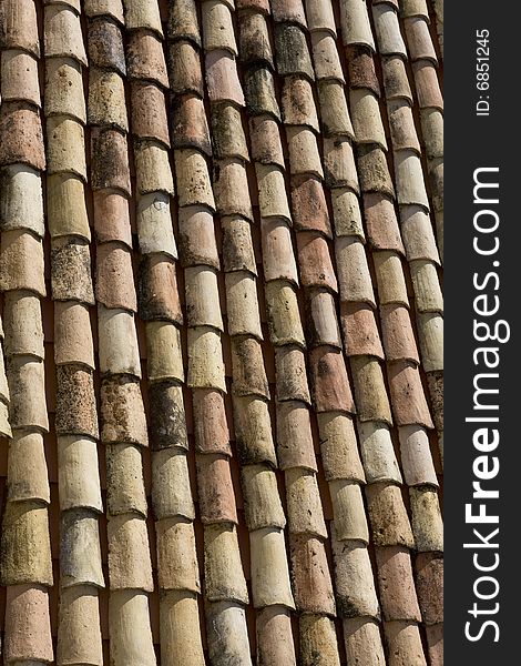 Old roof covered by vintage, clay tile