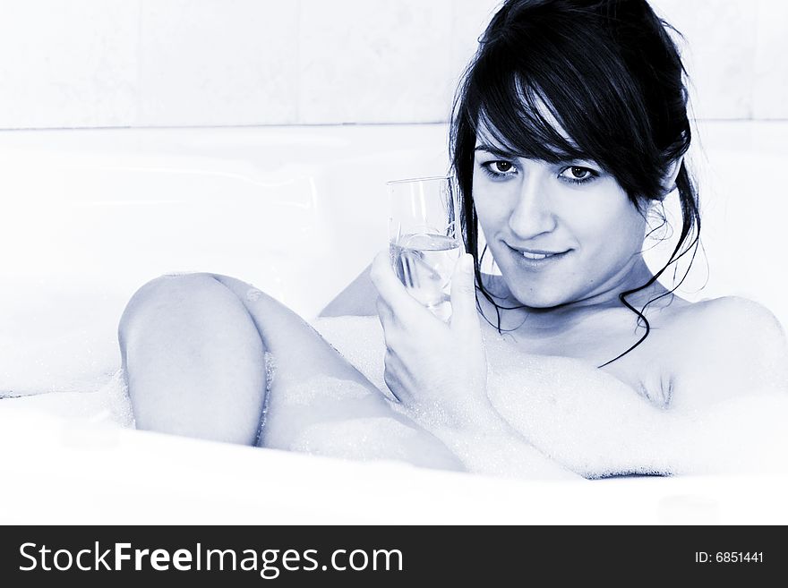 Young beautiful woman relaxing in jacuzzi. Young beautiful woman relaxing in jacuzzi