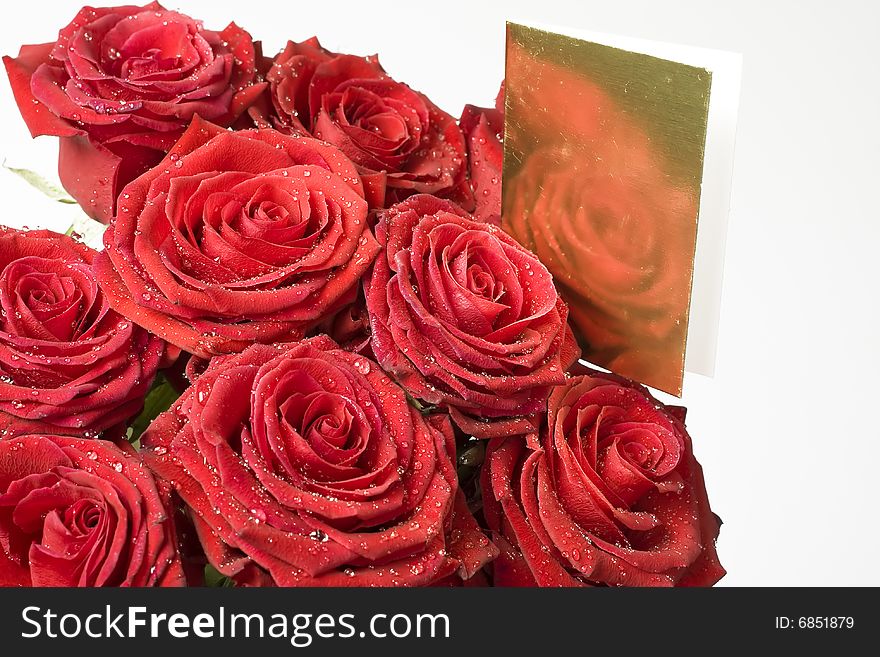 Background from red roses whit gold note card
