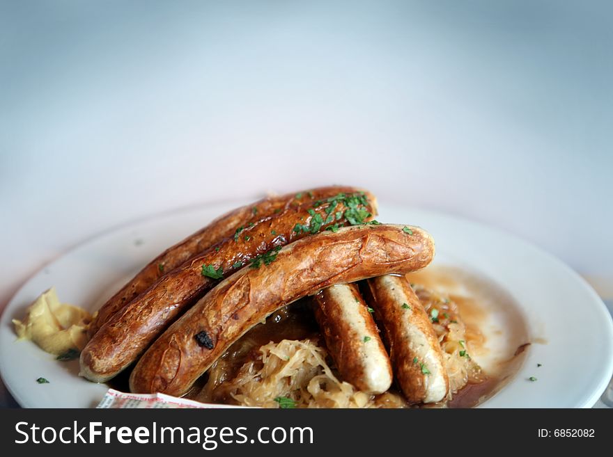 A  plate with spicy  Bavarian sausages. A  plate with spicy  Bavarian sausages