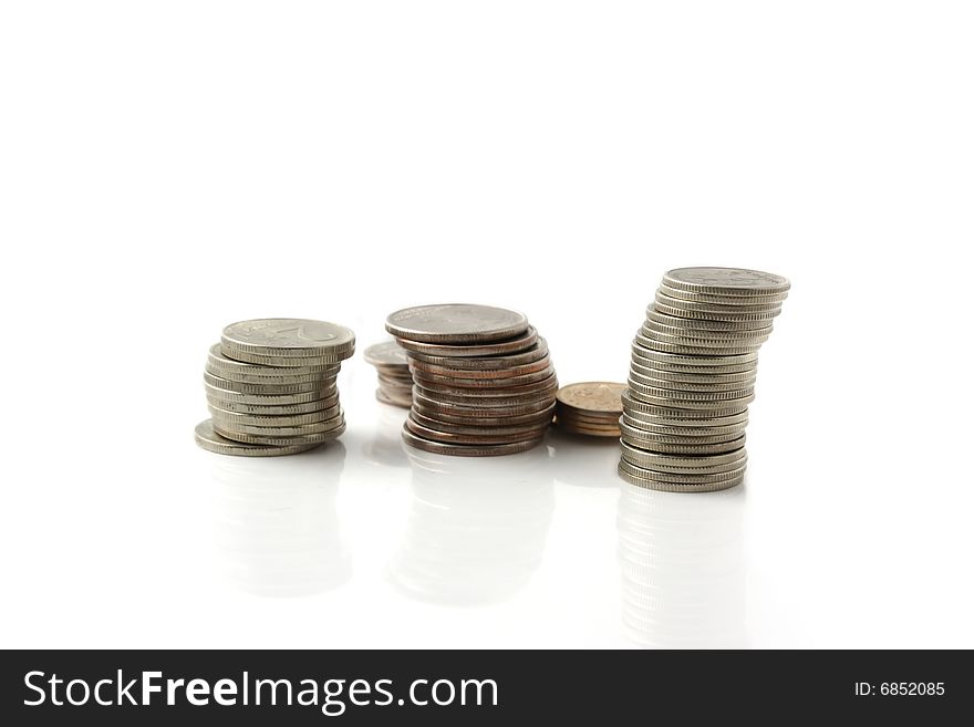 Rouleaus from coins, isolated on a white background