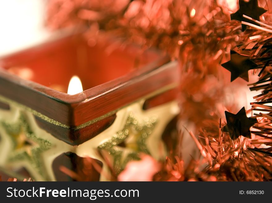 Red xmas candle and tinsels. Red xmas candle and tinsels