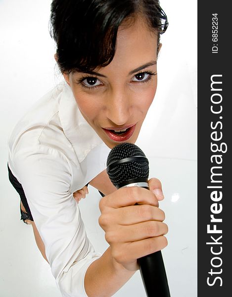 Ariel view of female singer performing on an isolated white background