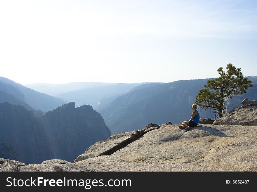 A woman gazing at the incredible view of mountains. A woman gazing at the incredible view of mountains