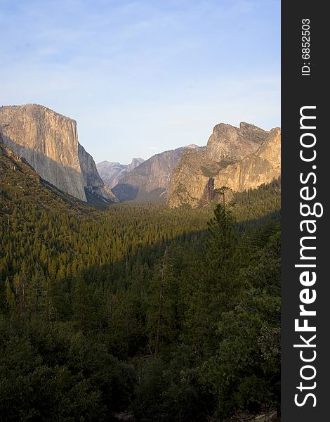 A wonderfull view of mountains with a forest in front of it. A wonderfull view of mountains with a forest in front of it