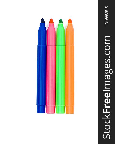 Varicoloured markers on the white isolated background