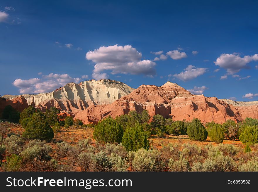 View of the red rock formations in Kodachrome Basin with blue skys and clouds. View of the red rock formations in Kodachrome Basin with blue skys and clouds