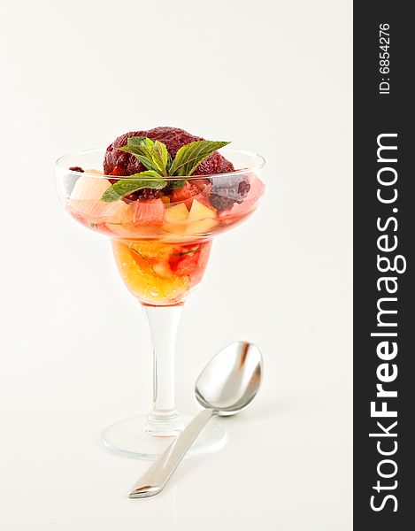 Sweet dessert with ice cream and fruits.