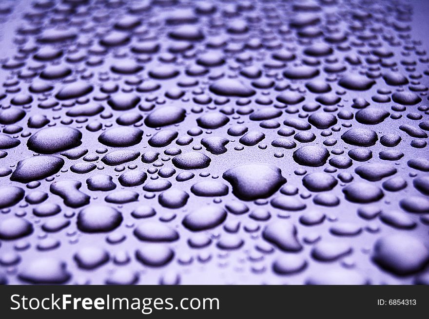 Water drops on shiny surface