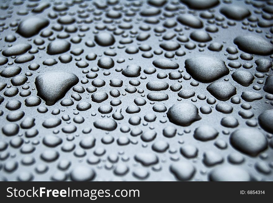 Water drops on shiny surface