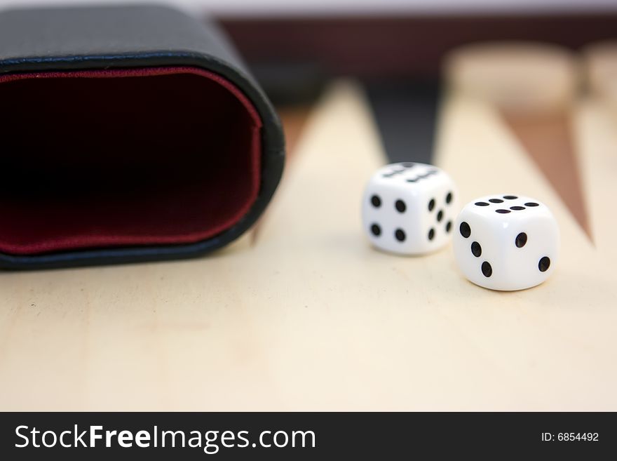 Two dices on backgammon board. Two dices on backgammon board