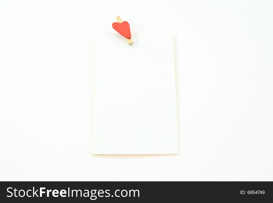 White card on a white background with heart