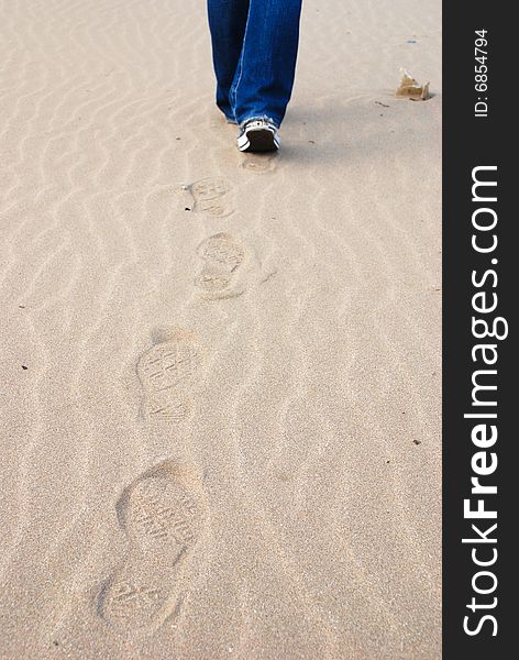 Woman walking in the sands. Woman walking in the sands