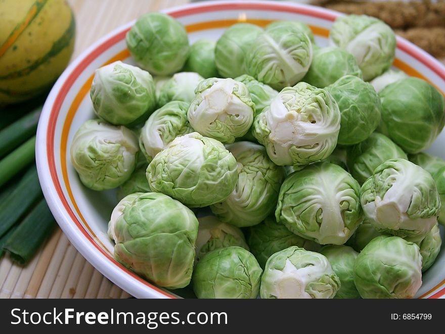 Some fresh green brussels in a bowl