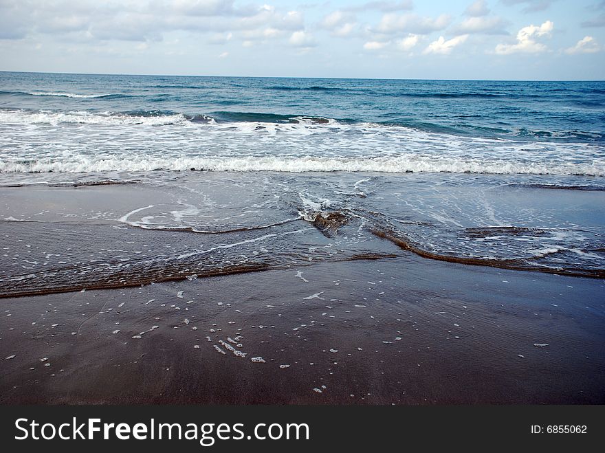 Waves breaking on the beach. Waves breaking on the beach