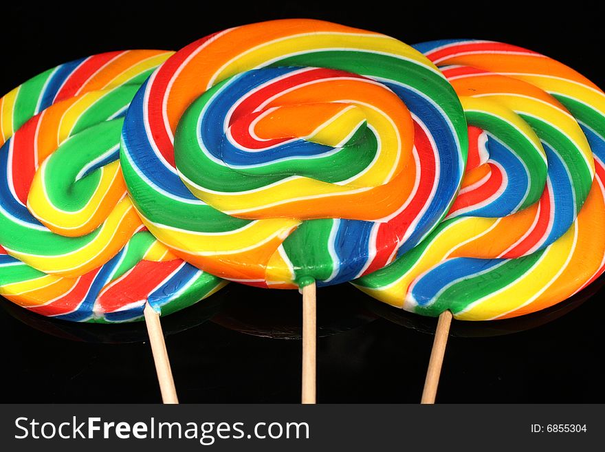 Closeup photo of large colorful lollipops.