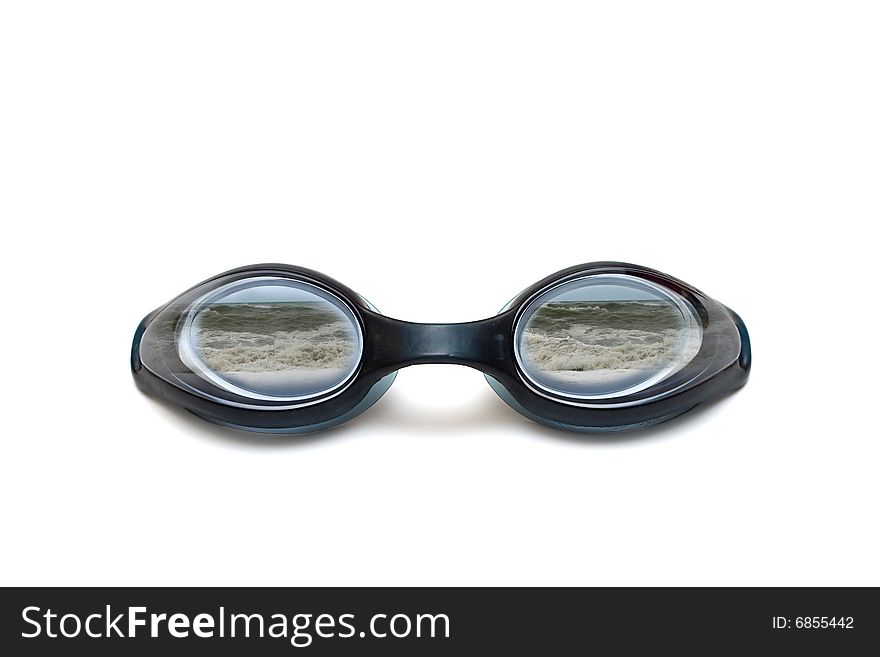 Black glasses for swim on white background reflected waves in sea. Black glasses for swim on white background reflected waves in sea