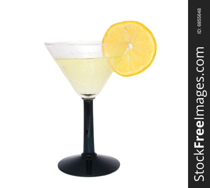 Cocktail in cocktail glass with slice of lemon