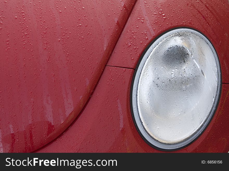 Lovely colourful car with water drops and headlight. Lovely colourful car with water drops and headlight