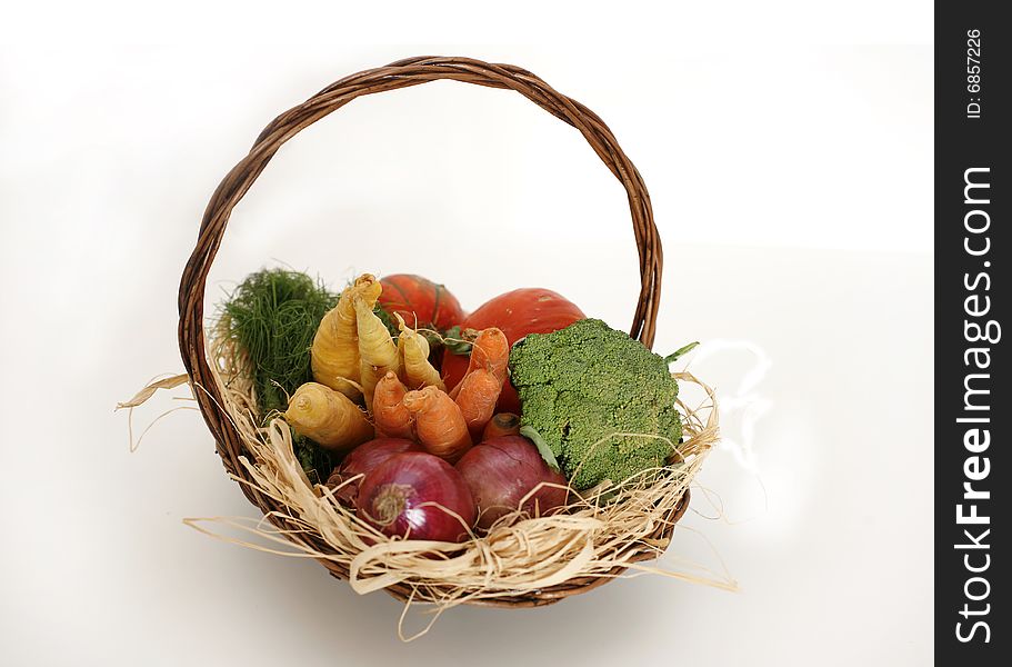 Mixed vegetable basket display on black background