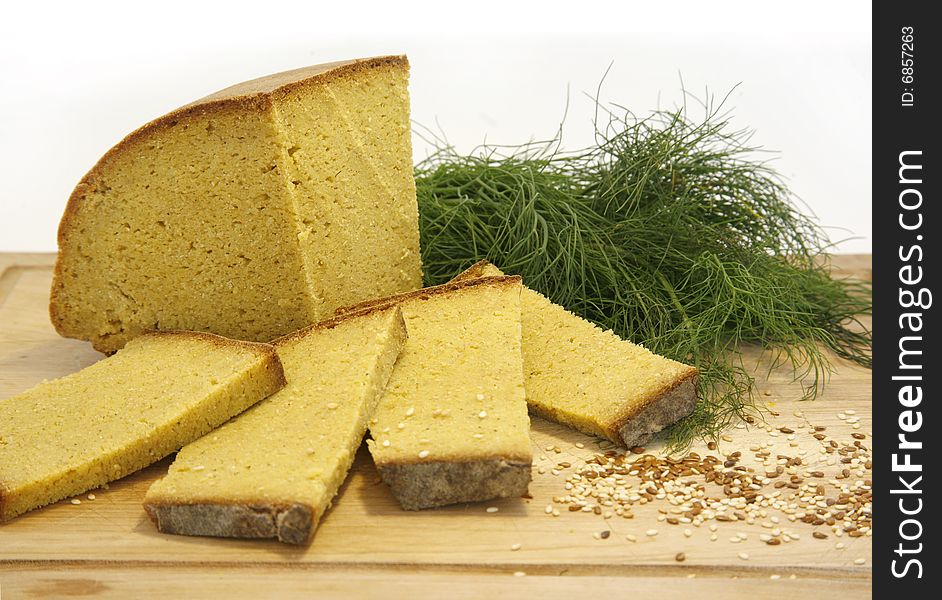 Fresh yellow corn bread display with seeds and herbs