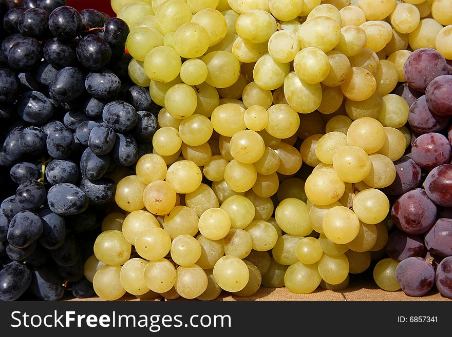 Display of fresh colourful grapes on market in Europe