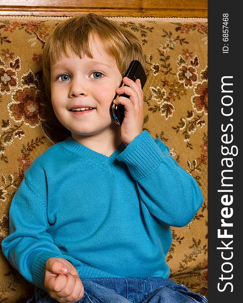 Portrait of adorable baby with mobile phone. studio shot