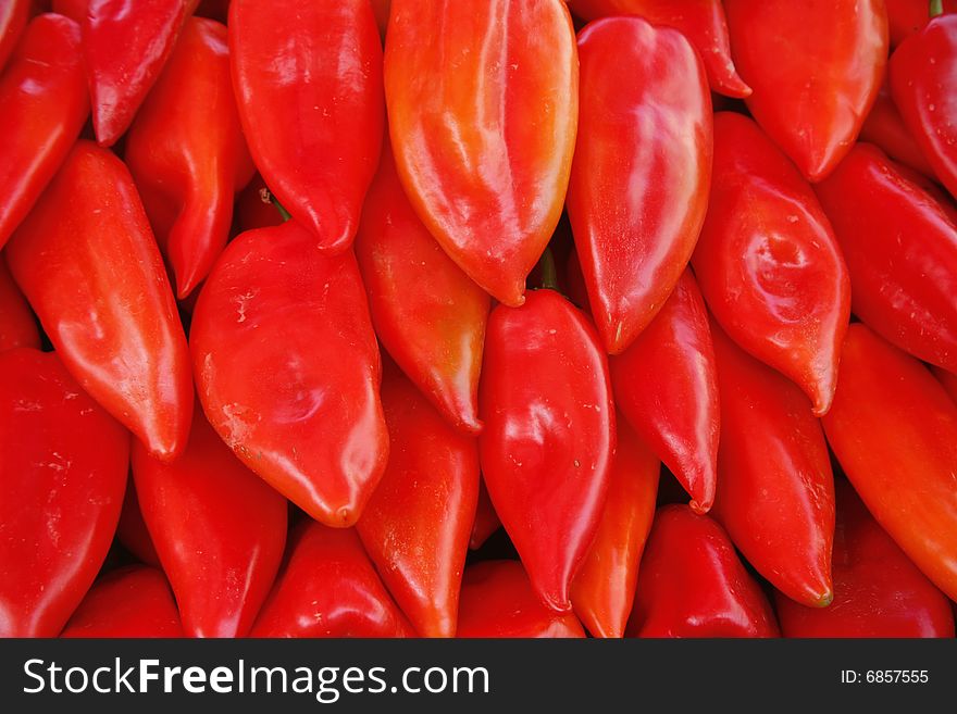 Display of red coloured peppers in market in Europe