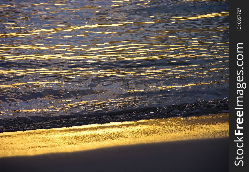 Sunset makes a lovely glow on a beach in Bermuda. Sunset makes a lovely glow on a beach in Bermuda.