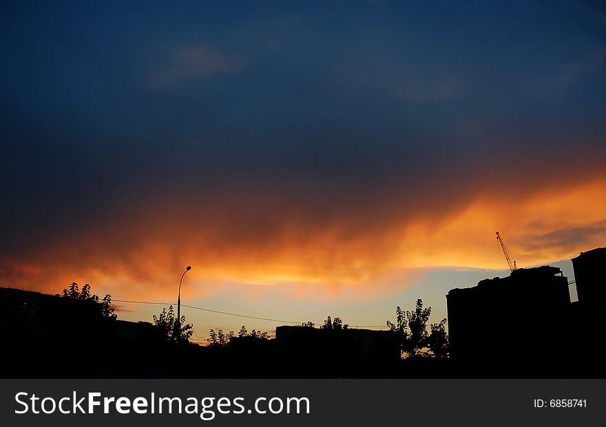 This photograph represents a colorful dramatic sky with cloud at sunset