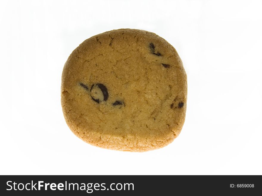 An isolated choc chip biscuit. An isolated choc chip biscuit.