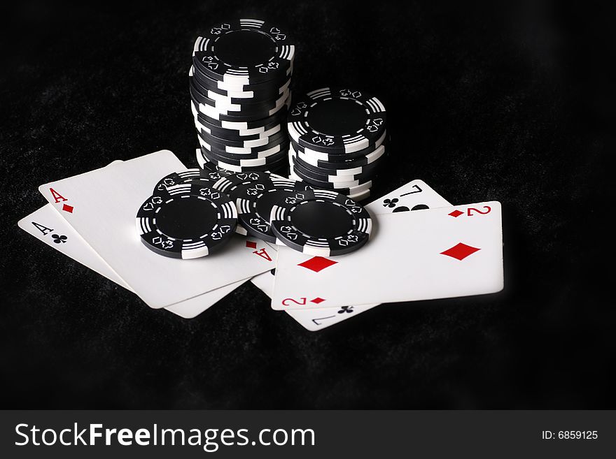 Best and worst possible poker hands to start with. Black background. Best and worst possible poker hands to start with. Black background.