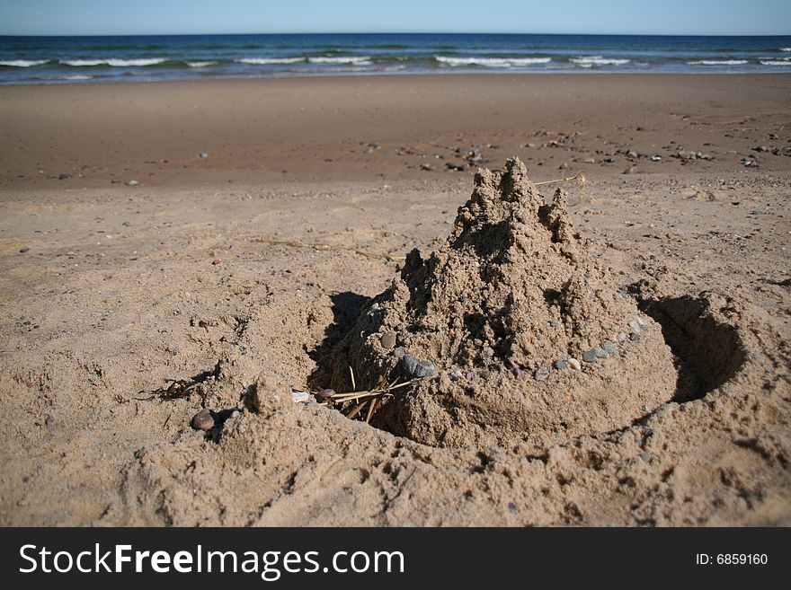 A sand castle on the ocean shore