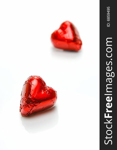 Chocolate love hearts isolated against a white background