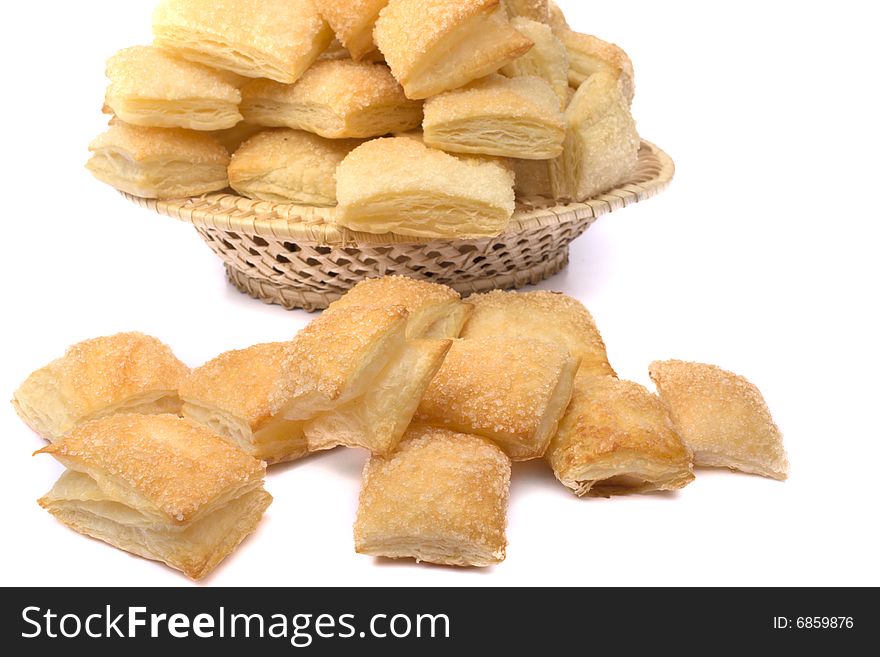 Puff cookies in a wum basket isolated on a white background
