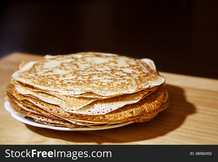 Stack of fresh hot pancakes on a plate closeup. Stack of fresh hot pancakes on a plate closeup