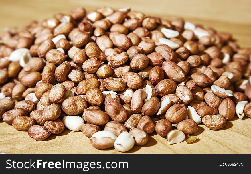 Large pile of peanuts on the table closeup