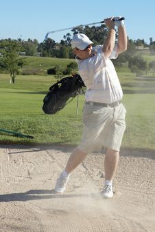 Golfer In Sand Bunker Royalty Free Stock Photos